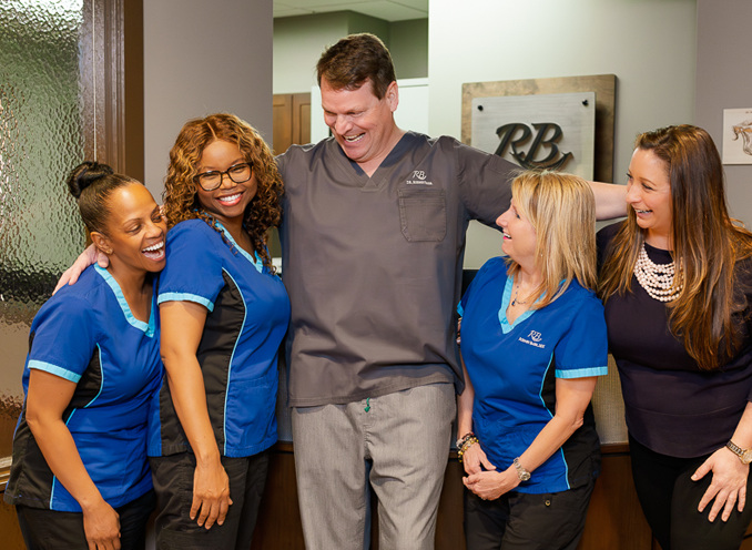 Dr. Rodney Baier with his dental team at the Sandy Springs office