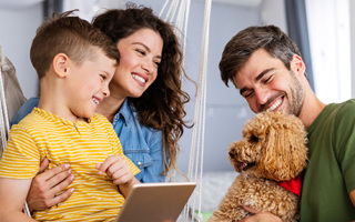 Family reading together, for preventive family dentistry
